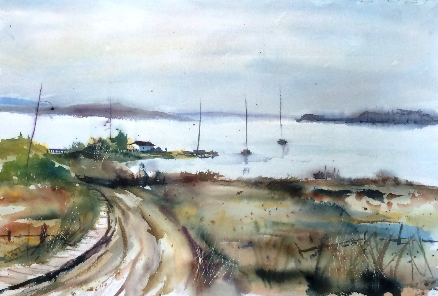 Watercolor landscape painting of a coastal scene with a winding path in the foreground, sailboats on calm water, distant landforms, and a pale overcast sky.
