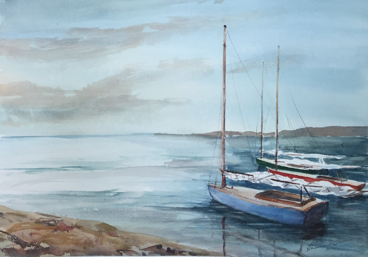 Watercolor painting of a calm coastal harbor scene with two sailboats moored in blue-gray water under a pale sky, with a sandy shore in the foreground and distant landforms on the horizon.