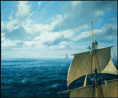 Sailing ship on the ocean with a blue sky and clouds